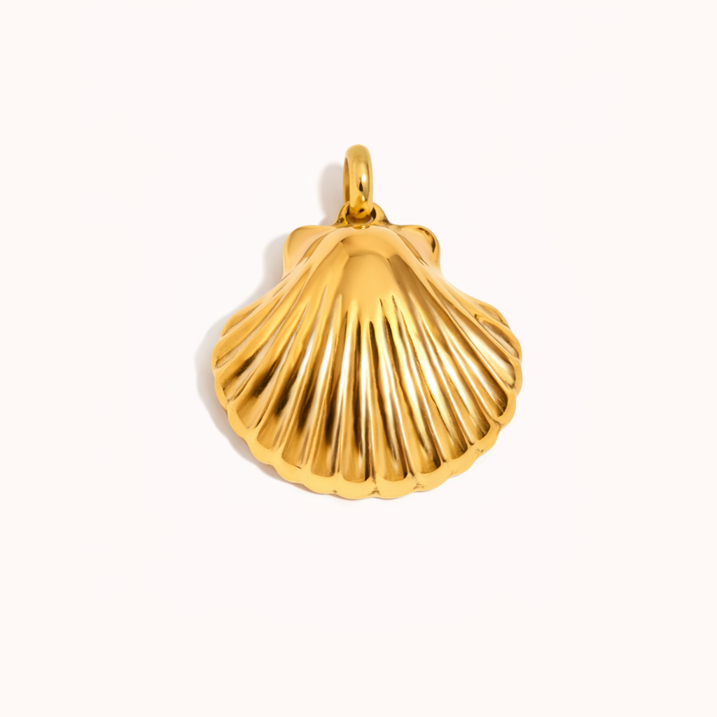 Gold seashell shaped charm pendant with sculpted ridged texture